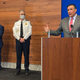In this April 21, 2021 file photo, Columbus Mayor Andrew Ginther, right, speaks during a news conference in Columbus, Ohio, announcing technical assistance from the Justice Department in the wake of allegations misconduct in the city’s police department. A Black woman officer just won her racial discrimination lawsuit against the force.